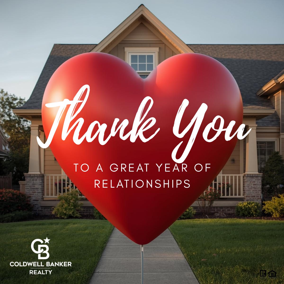 Large red heart in front of a suburban home with text reading “Thank You – To a Great Year of Relationships,” featuring Coldwell Banker Realty branding.